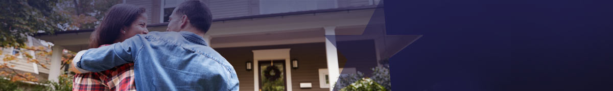 couple in front of their home