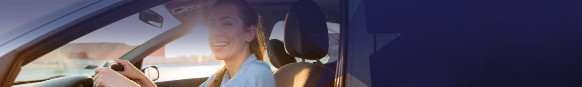 Woman behind the wheel in a car