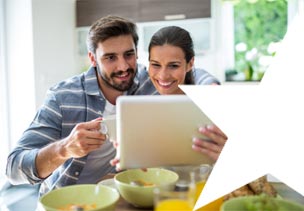 Couple looking at their laptop